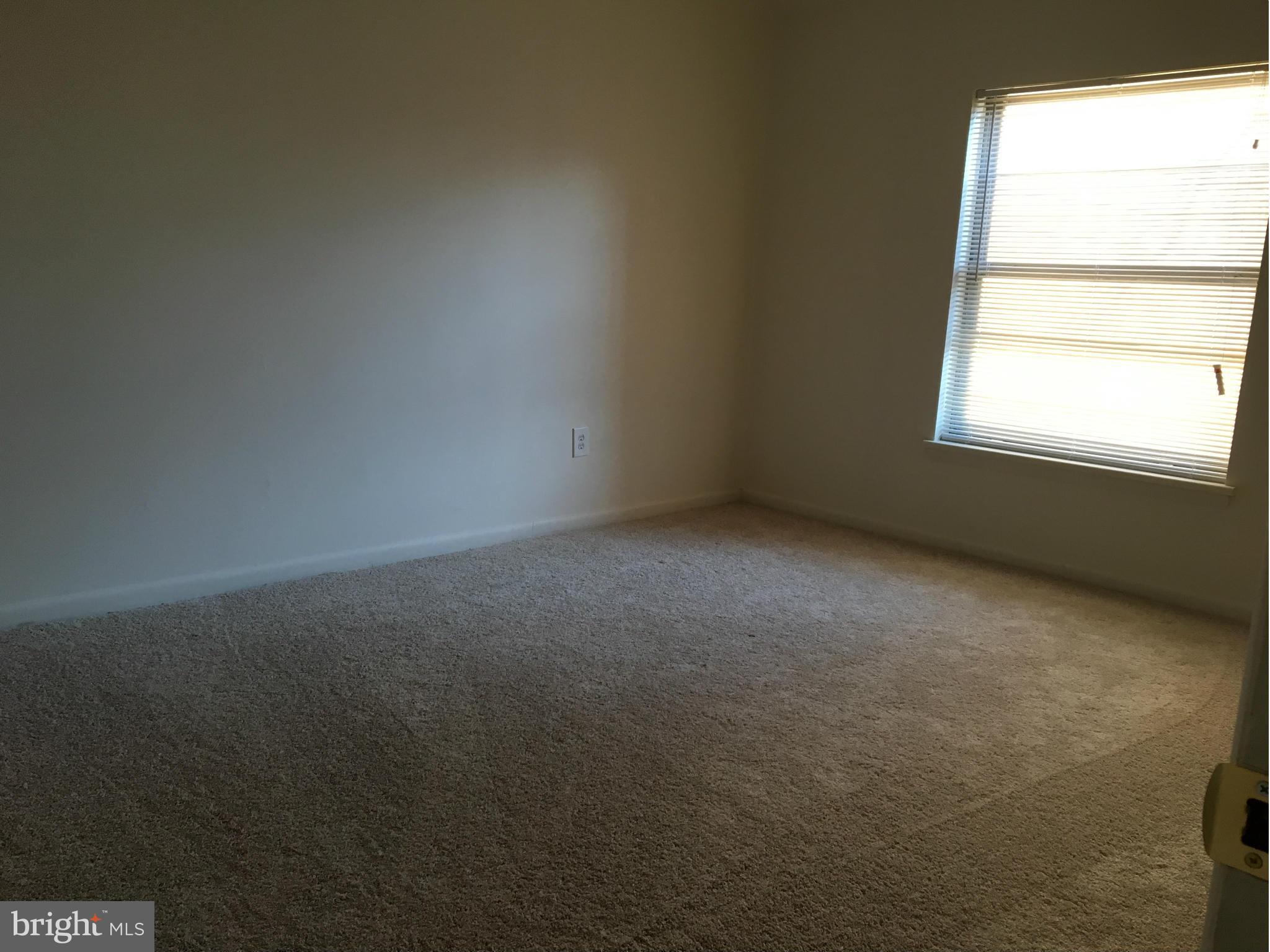3803 St Barnabas Road, Unit T Suitland, MD 20746 - Photo 11 of 13 an empty room with a window