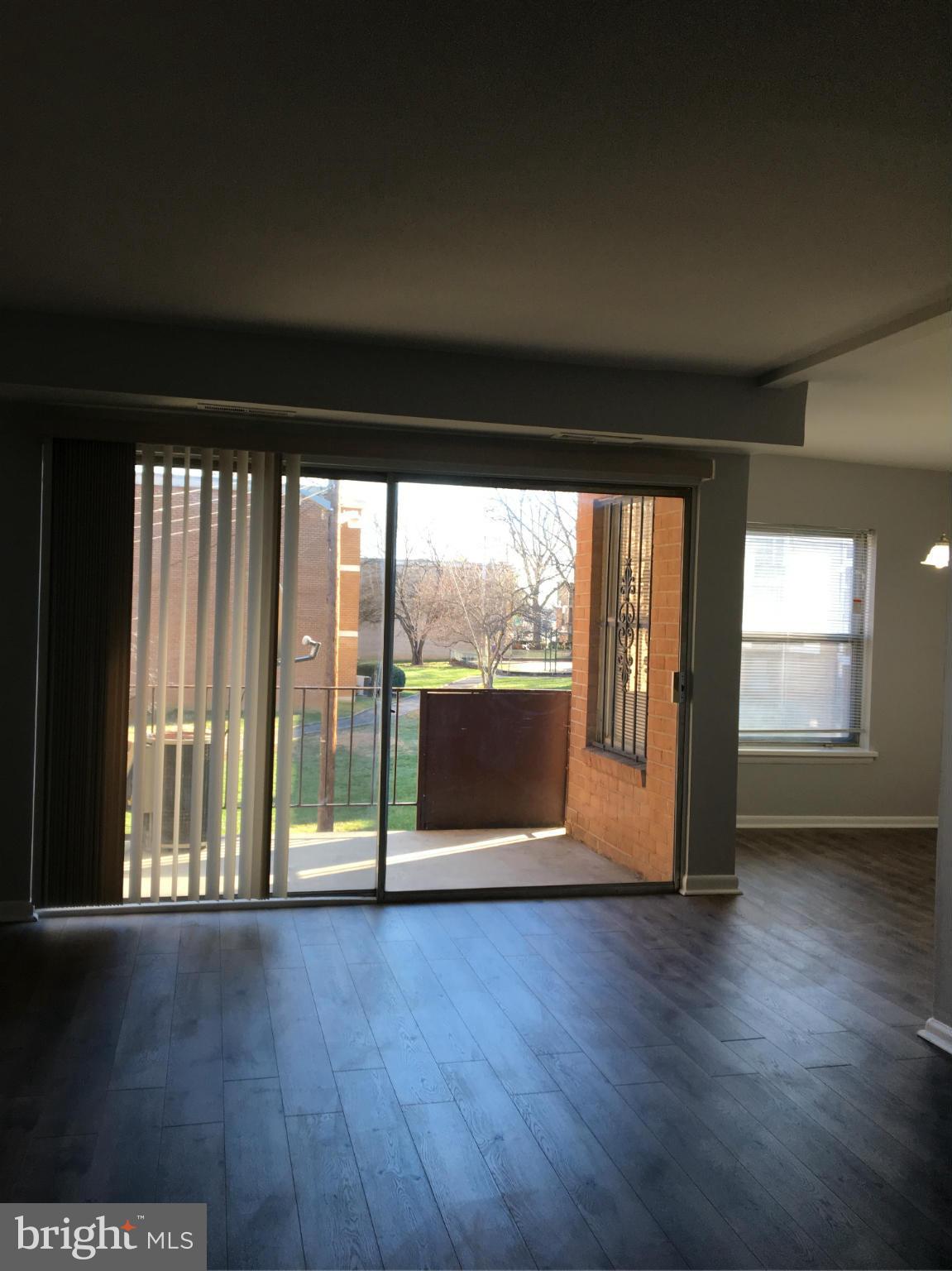 3803 St Barnabas Road, Unit T Suitland, MD 20746 - Photo 13 of 13 a view of empty room with wooden floor and fan