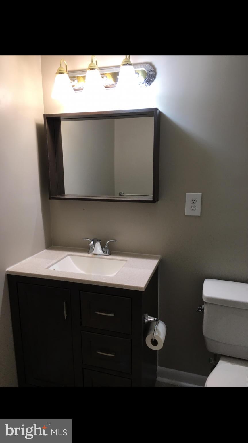 3803 St Barnabas Road, Unit T Suitland, MD 20746 - Photo 9 of 13 a bathroom with a sink and a toilet