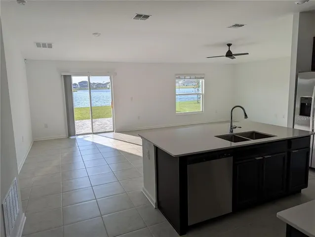a kitchen with a sink and a window