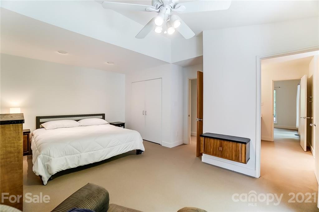 1860 Montague Road Clover, SC 29710 - Photo 20 of 48 a bedroom with a bed and a chandelier