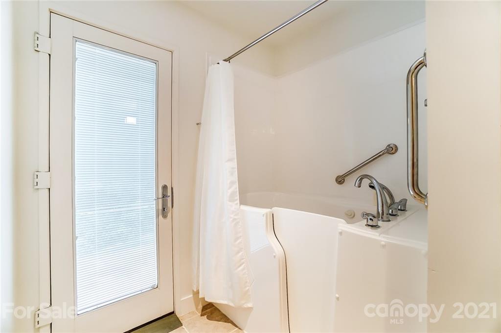 1860 Montague Road Clover, SC 29710 - Photo 22 of 48 a bathroom with a sink a mirror and shower
