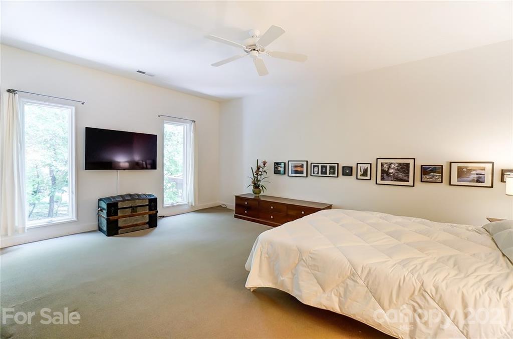 1860 Montague Road Clover, SC 29710 - Photo 30 of 48 a bedroom with a bed and a chandelier