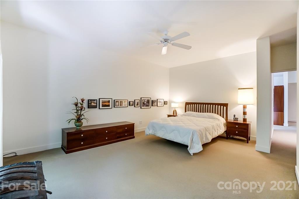 1860 Montague Road Clover, SC 29710 - Photo 31 of 48 a spacious bedroom with a bed and a lamp