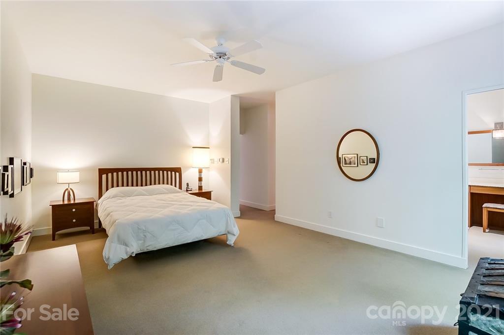 1860 Montague Road Clover, SC 29710 - Photo 32 of 48 a bedroom with a bed and a chandelier