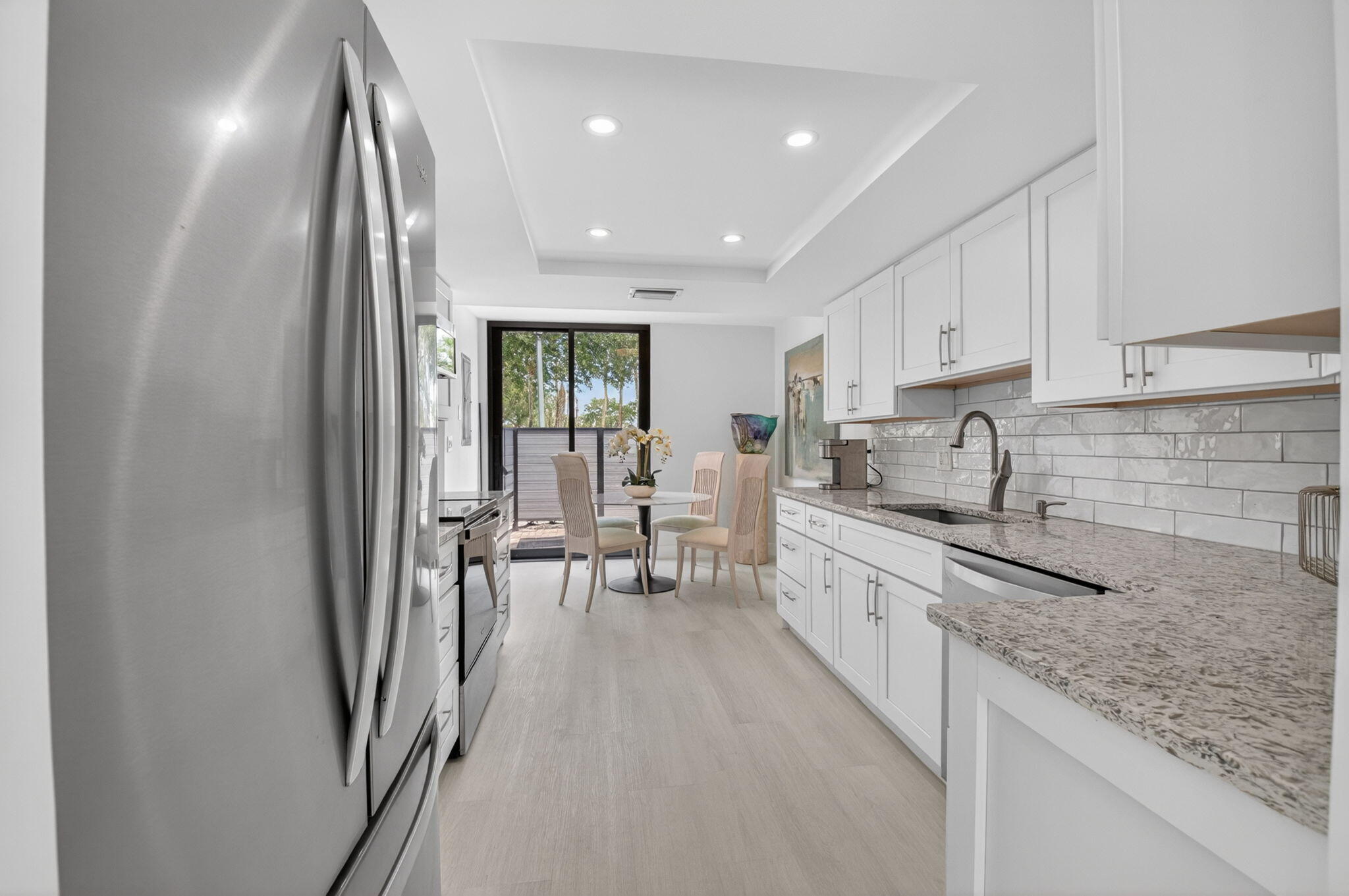 3708 Bridgewood Drive Boca Raton, FL 33434 - Photo 11 of 37 a large kitchen with stainless steel appliances granite countertop a lot of counter space and a sink