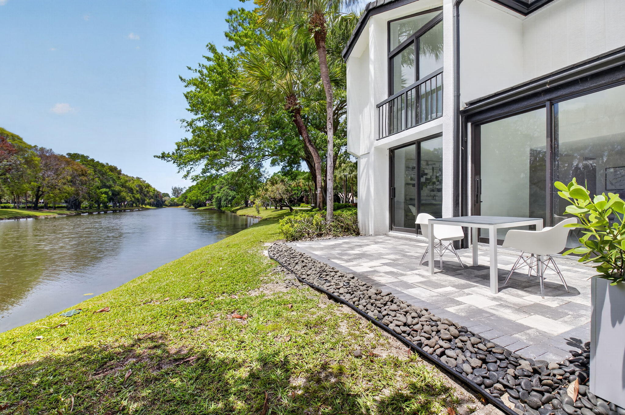 3708 Bridgewood Drive Boca Raton, FL 33434 - Photo 18 of 37 a view of a house with lake and a garden