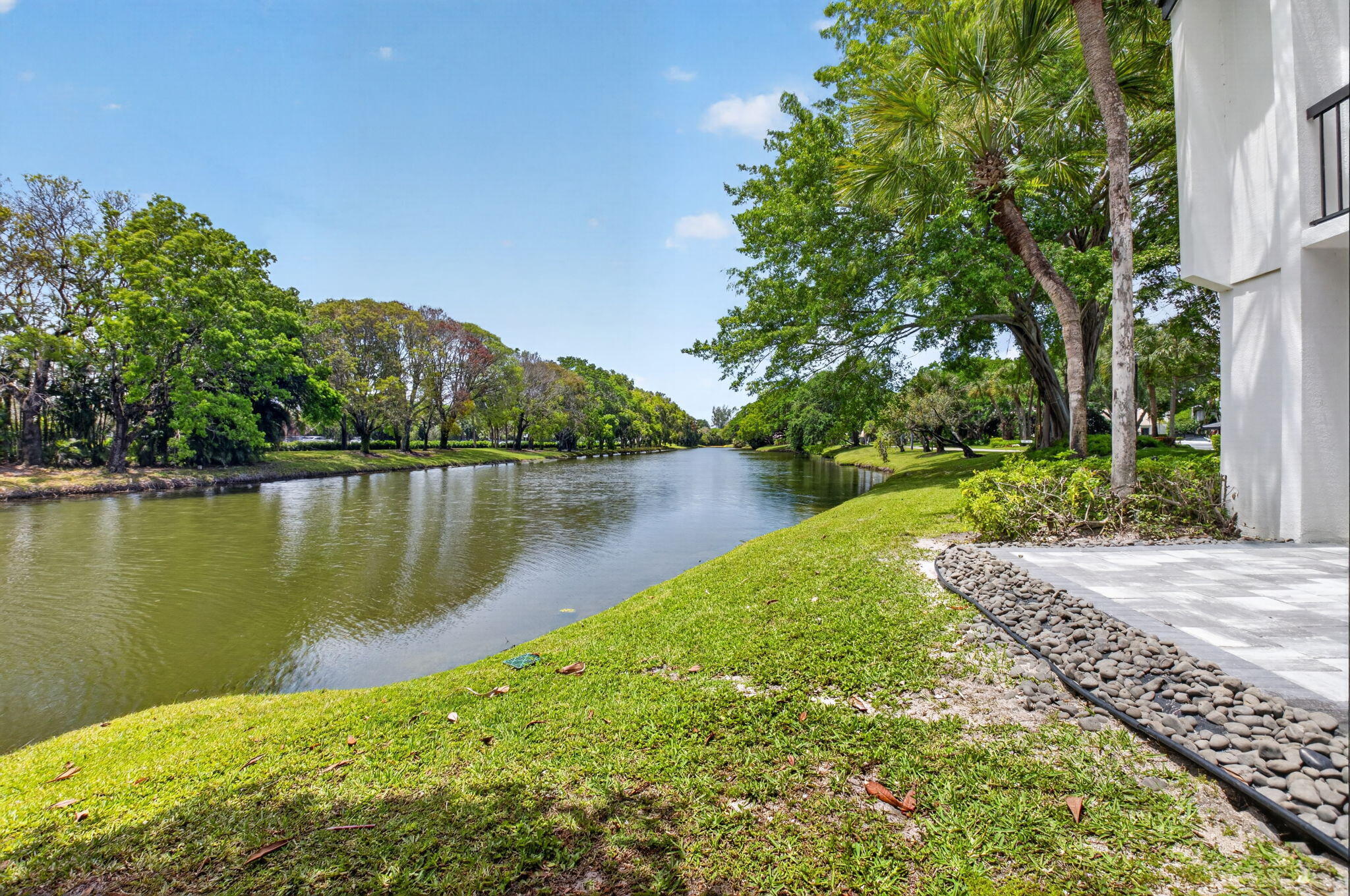 3708 Bridgewood Drive Boca Raton, FL 33434 - Photo 19 of 37 a view of a lake with a garden