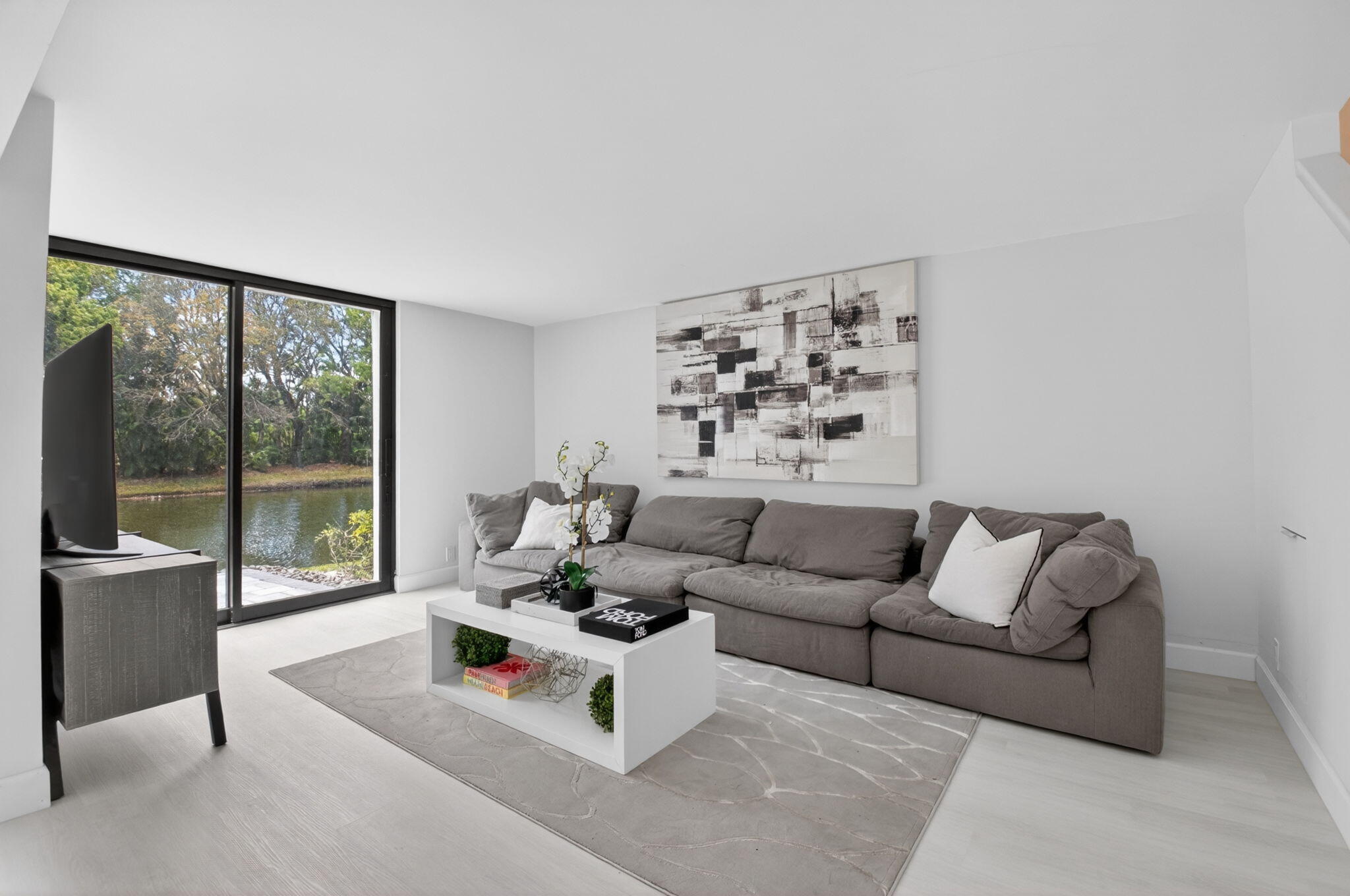 3708 Bridgewood Drive Boca Raton, FL 33434 - Photo 2 of 37 a living room with furniture and a large window