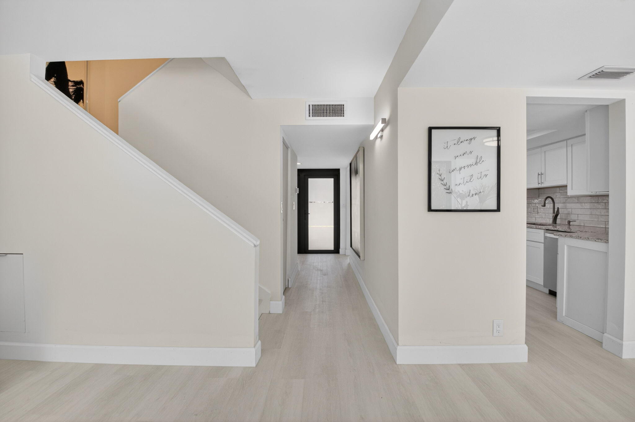 3708 Bridgewood Drive Boca Raton, FL 33434 - Photo 21 of 37 a view of a hallway with entryway and wooden floor