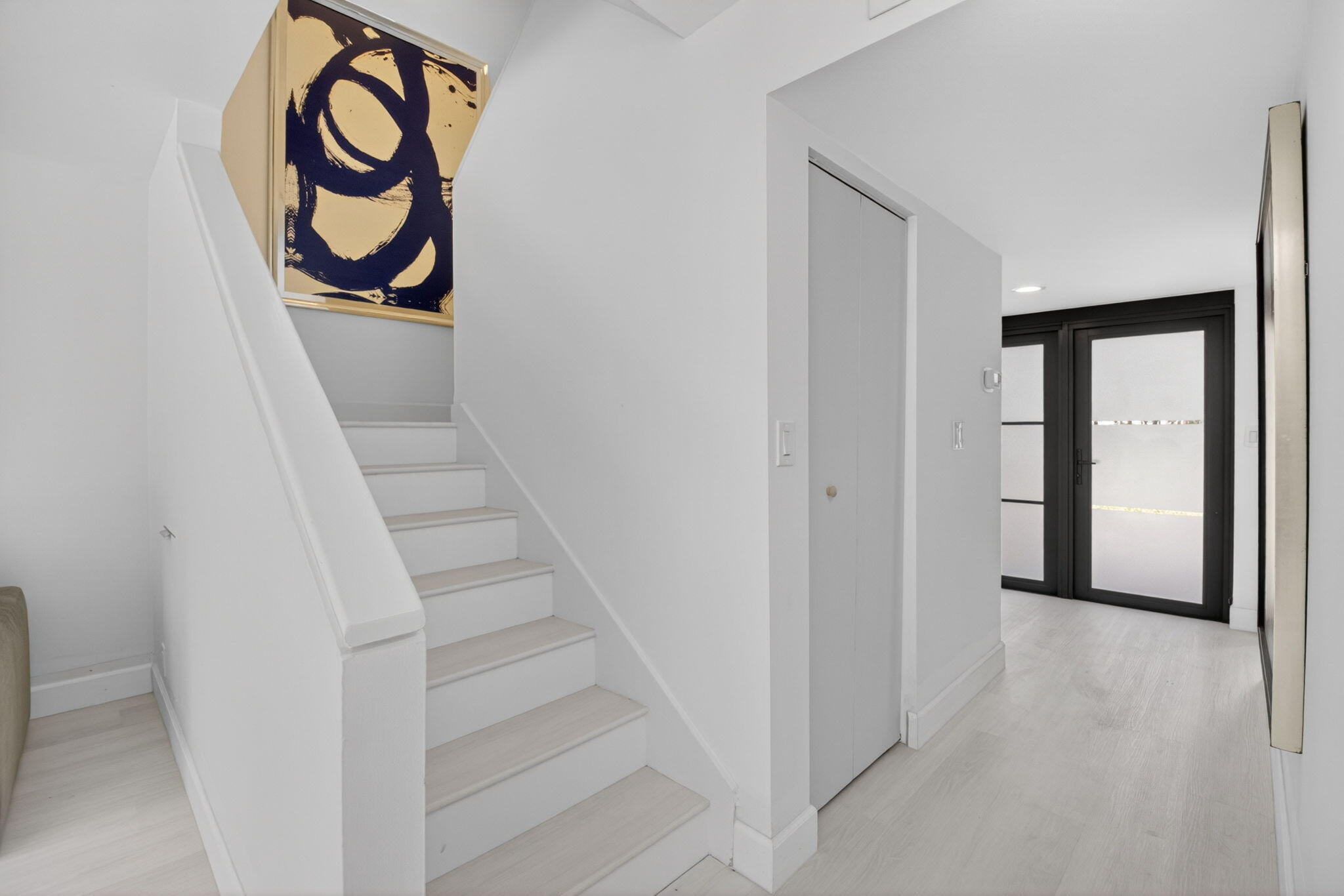 3708 Bridgewood Drive Boca Raton, FL 33434 - Photo 22 of 37 a view of a hallway with wooden floor and white door