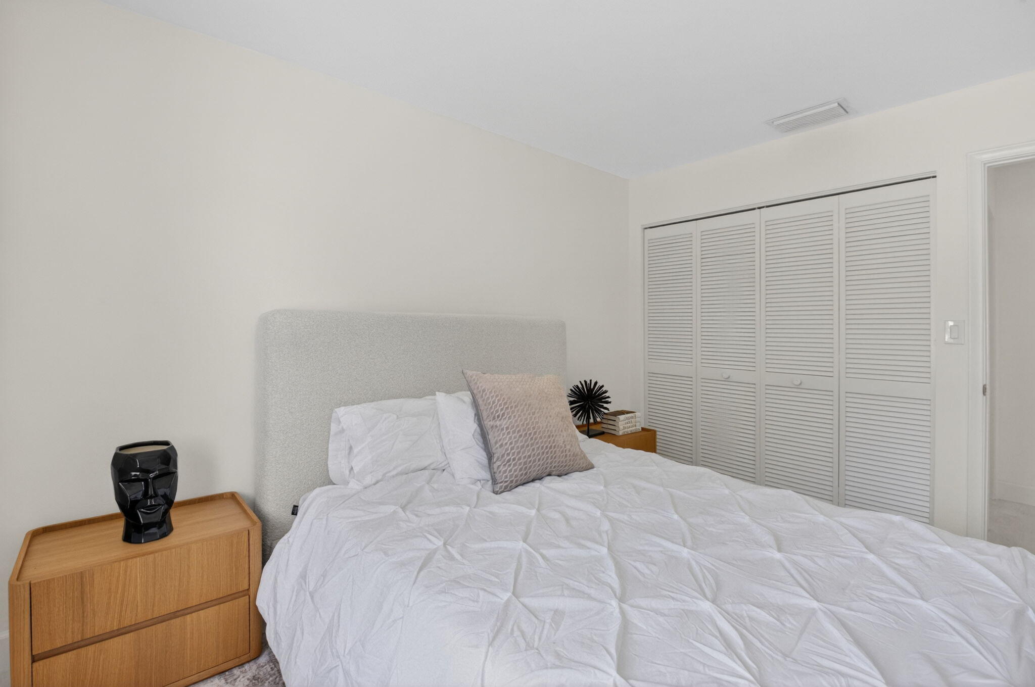 3708 Bridgewood Drive Boca Raton, FL 33434 - Photo 25 of 37 a bedroom with a bed and a wooden floor