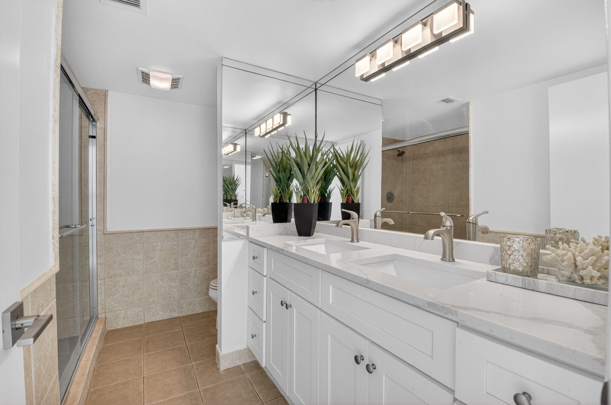3708 Bridgewood Drive Boca Raton, FL 33434 - Photo 29 of 37 a bathroom with a double vanity sink and a mirror