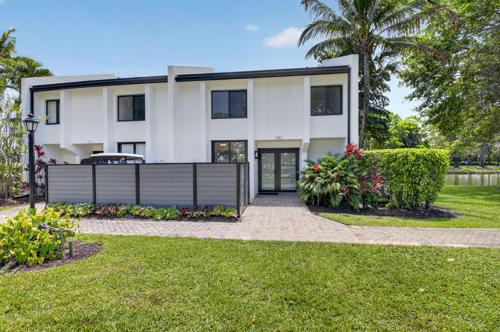 3708 Bridgewood Drive Boca Raton, FL 33434 - Photo 32 of 37 a front view of a house with garden