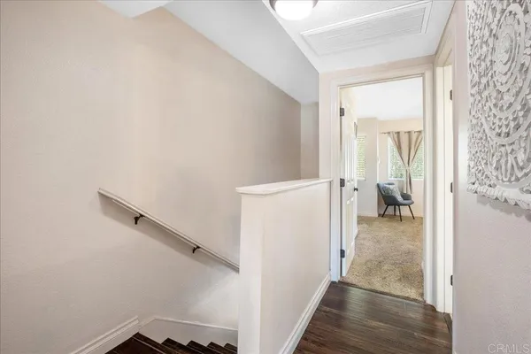 a view of a room that has a bed and a view of bathroom