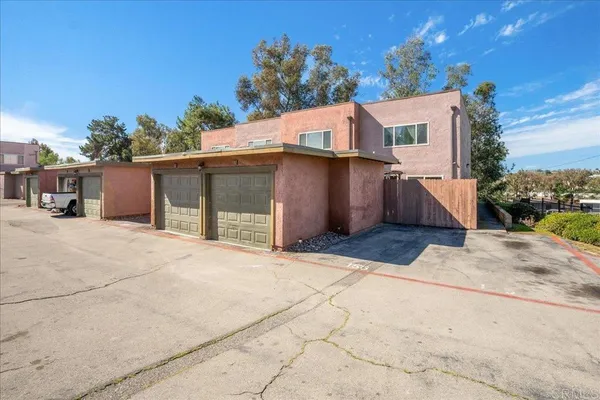 a view of a house with a yard and garage