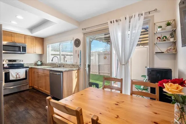 a kitchen with a refrigerator and a sink