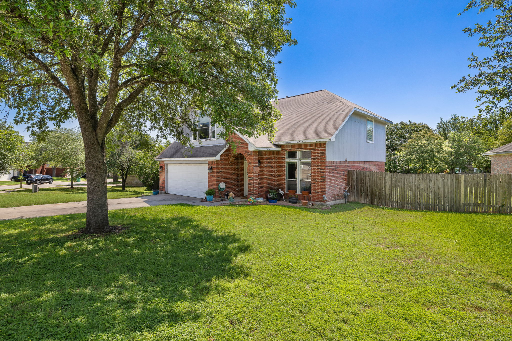 615 Runners Ridge Pflugerville, TX 78660 - Photo 3 of 32 a view of a house with a yard and tree