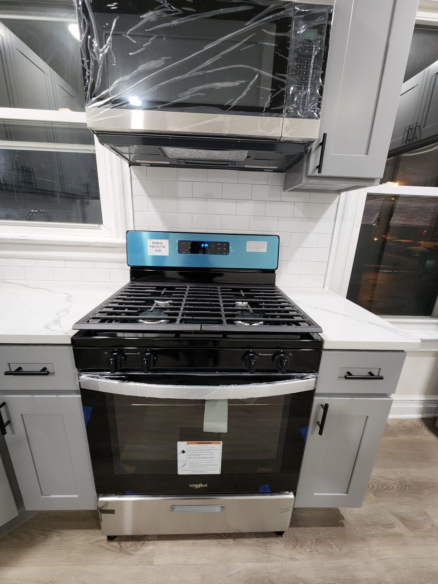 65 Halstead Street, Unit 2 Kearny, NJ 07032 - Photo 5 of 16 a stove top oven sitting inside of a kitchen