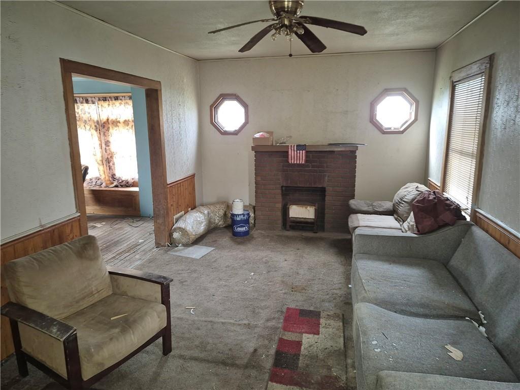 689 South State Line Road Sharon, PA 16146 - Photo 4 of 19 a living room with furniture and a fireplace