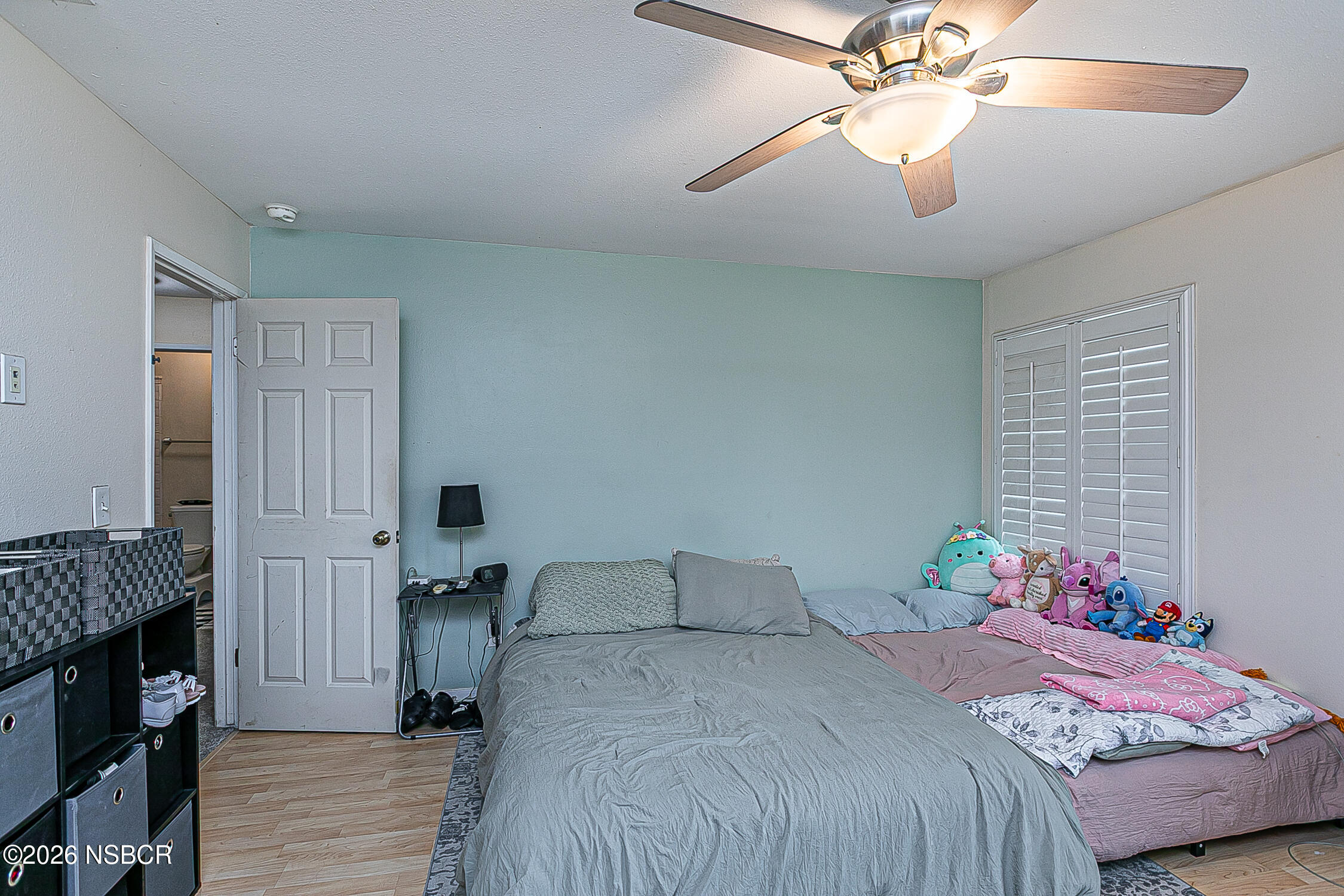 712 Pebble Beach Place Santa Maria, CA 93454 - Photo 22 of 31 a bedroom with a bed and a chandelier