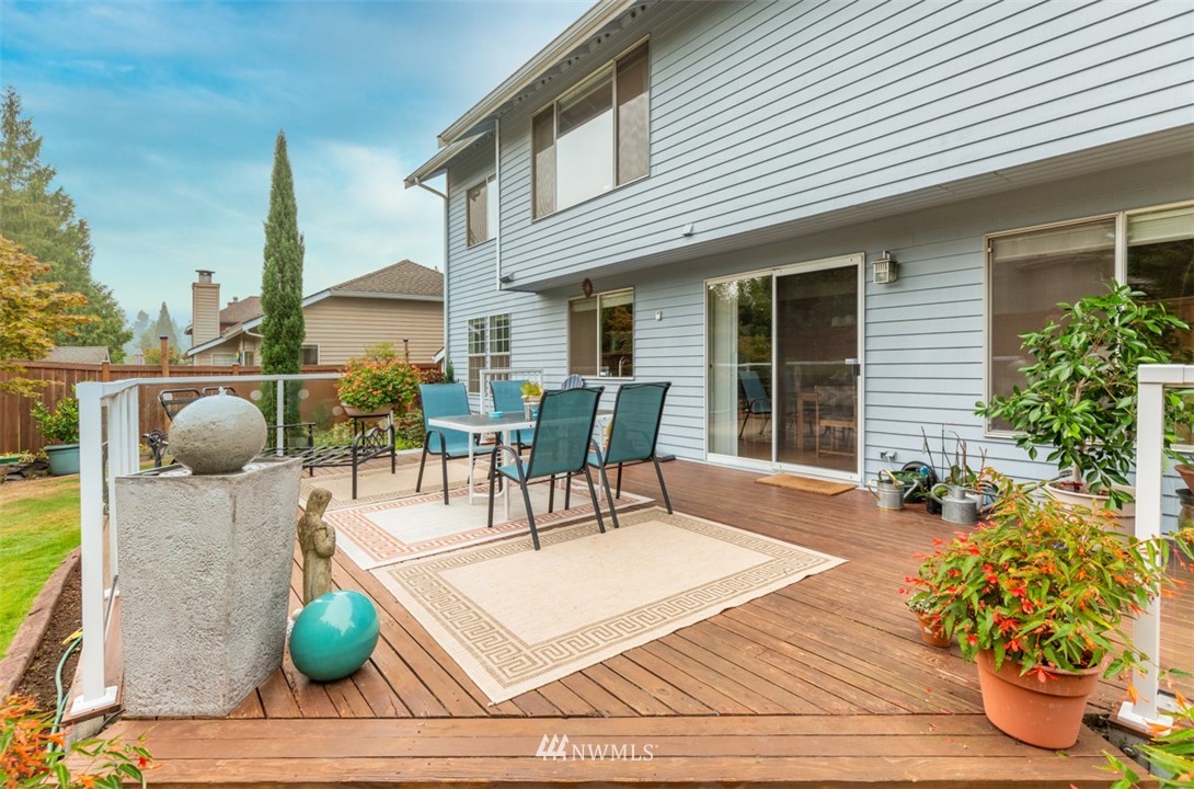 15720 Southeast 184th Street Renton, WA 98058 - Photo 11 of 30 a view of outdoor dining space with furniture and wooden floor