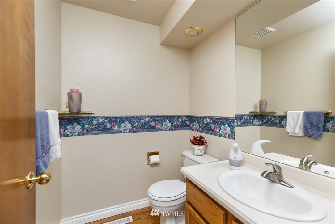 15720 Southeast 184th Street Renton, WA 98058 - Photo 22 of 30 a bathroom with a sink and a toilet