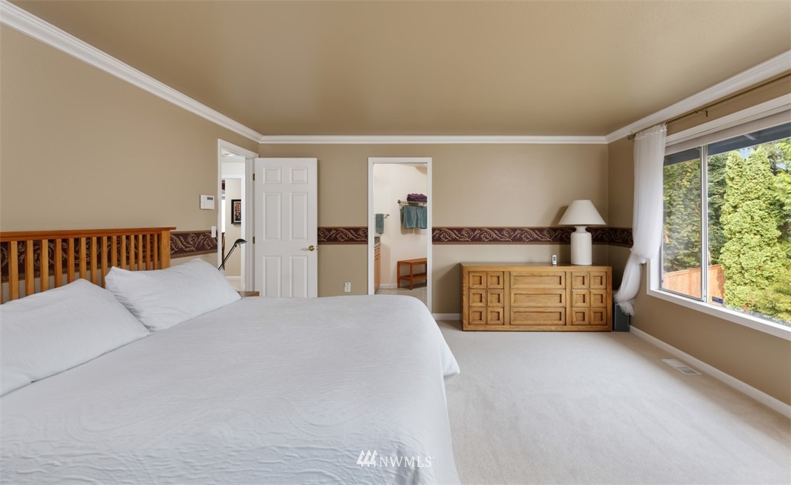 15720 Southeast 184th Street Renton, WA 98058 - Photo 25 of 30 a bedroom with a bed and a large window