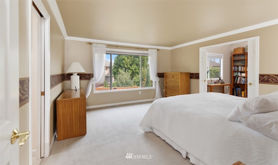 15720 Southeast 184th Street Renton, WA 98058 - Photo 26 of 30 a bedroom with a bed and a large window