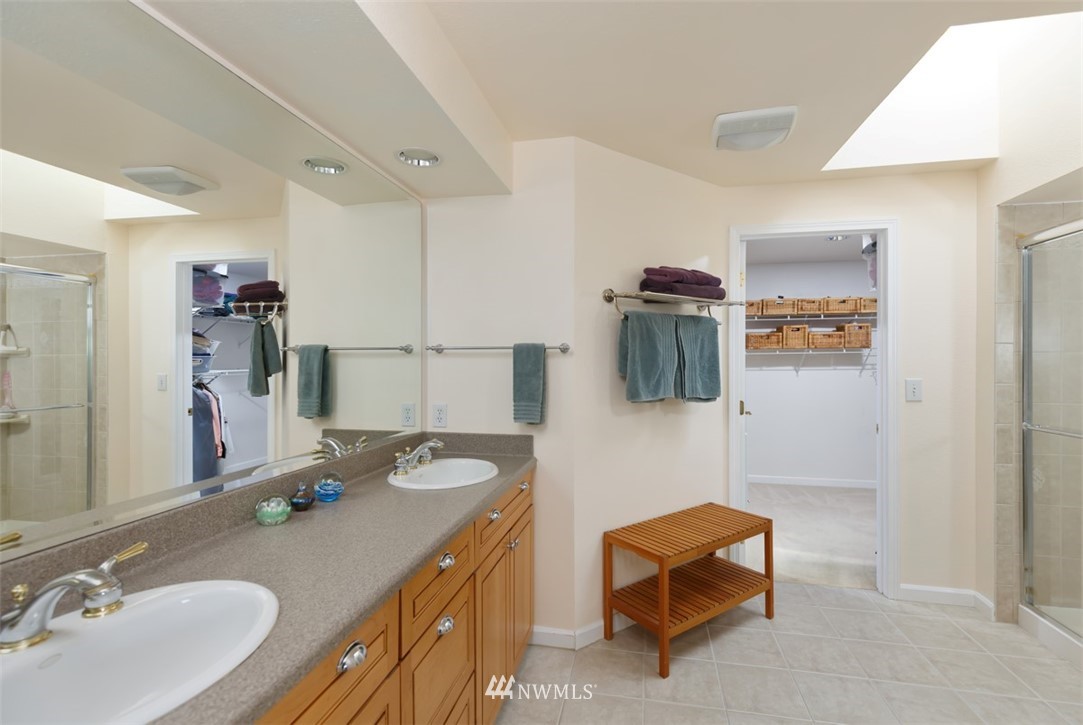 15720 Southeast 184th Street Renton, WA 98058 - Photo 27 of 30 a bathroom with a sink double vanity and a mirror