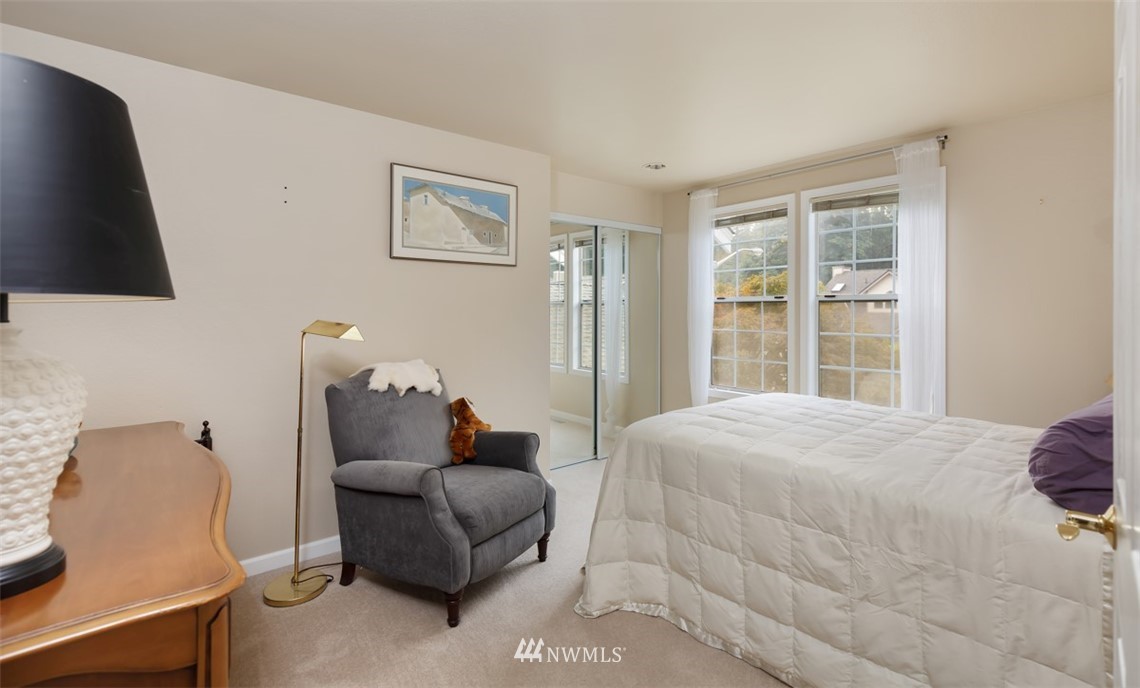 15720 Southeast 184th Street Renton, WA 98058 - Photo 28 of 30 a bedroom with a bed and couch