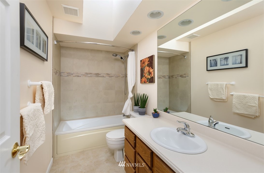 15720 Southeast 184th Street Renton, WA 98058 - Photo 29 of 30 a bathroom with a sink toilet and shower