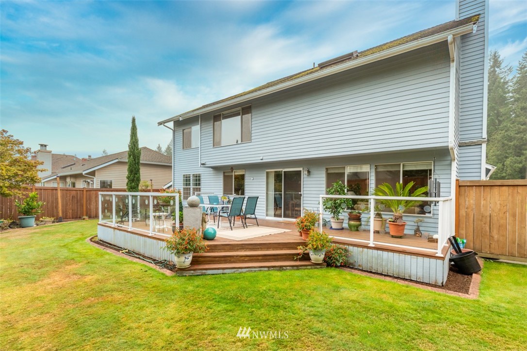15720 Southeast 184th Street Renton, WA 98058 - Photo 10 of 30 a view of a house with a big yard and large tree