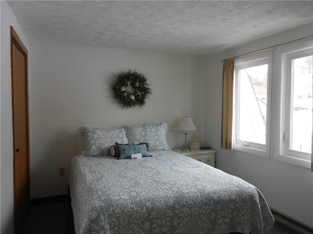 1373 Post Road, Unit 100C Wells, ME 04090 - Photo 13 of 25 Cheerful guest bedroom with closet...