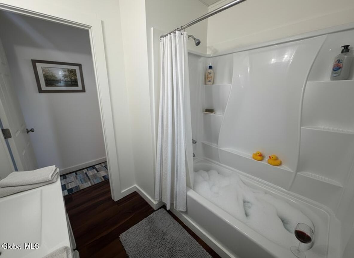8 Harrison Avenue Rensselaer, NY 12144 - Photo 14 of 22 Bathroom Tub with rubber duckie and wine
