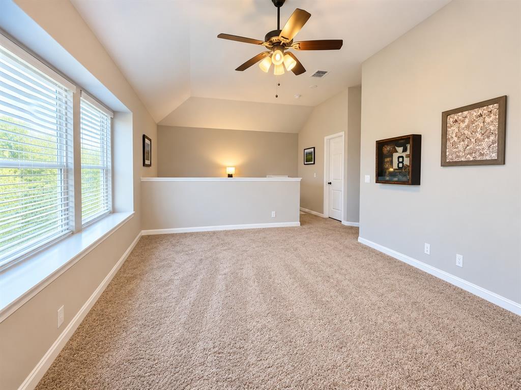 3301 Heathrow Road Mesquite, TX 75181 - Photo 12 of 26 Neutral-toned walls complement the plush carpet flooring