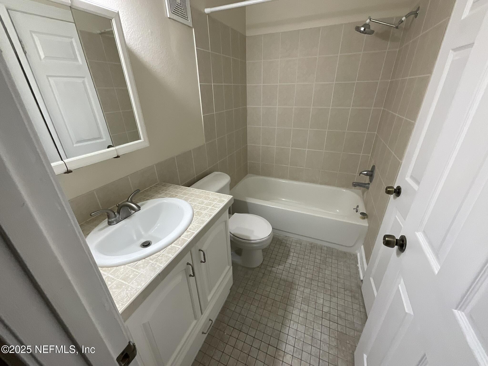 650 West Pope Road, Unit 252 St. Augustine, FL 32080 - Photo 24 of 33 a bathroom with a sink a toilet and shower