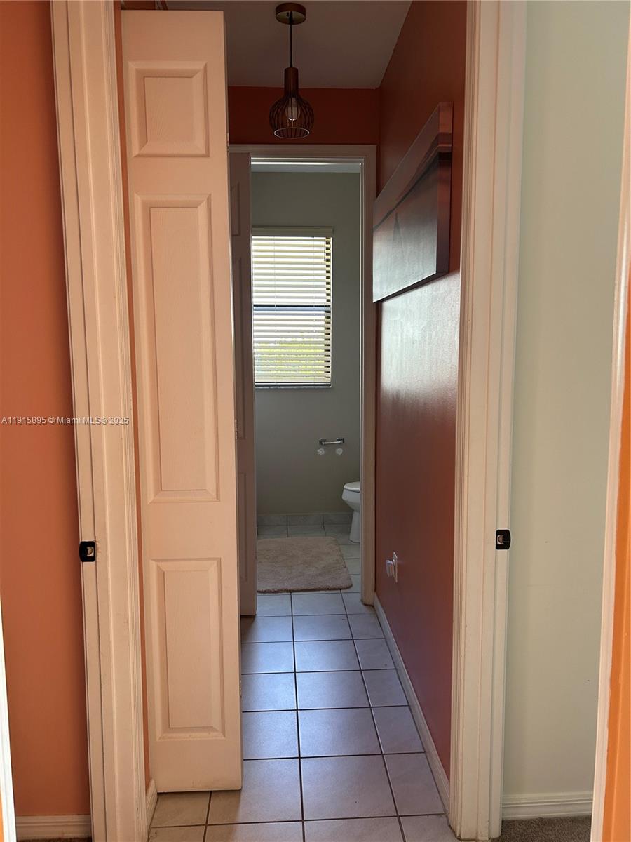 5518 Useppa Drive Immokalee, FL 34142 - Photo 6 of 13 a bathroom with a mirror and a shower