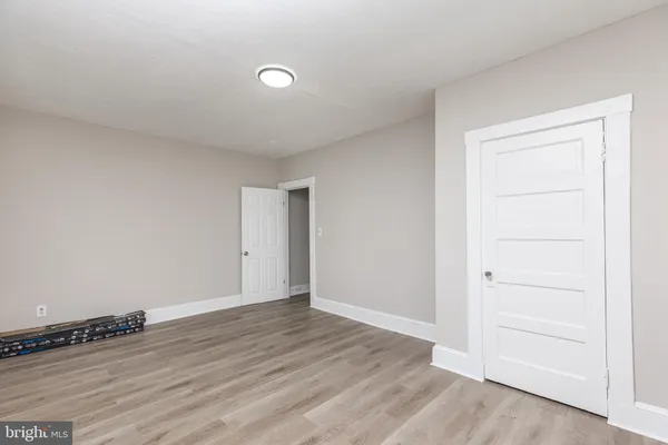 an empty room with wooden floor