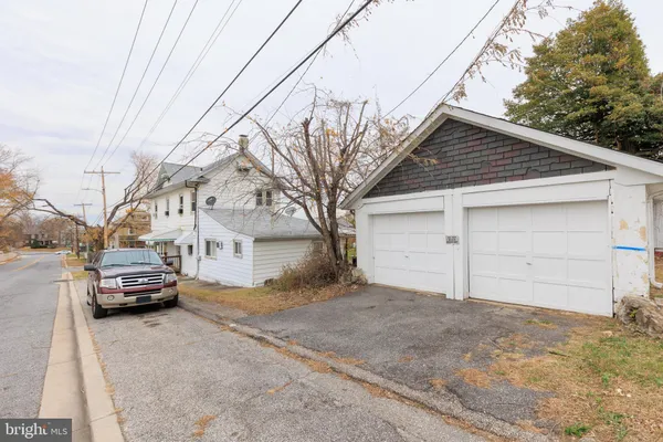a view of parking space in front of house