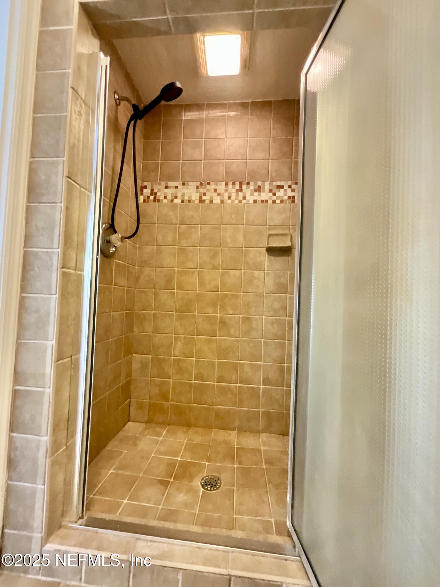 145 Depot Road Hawthorne, FL 32640 - Photo 31 of 73 a bathroom with a shower