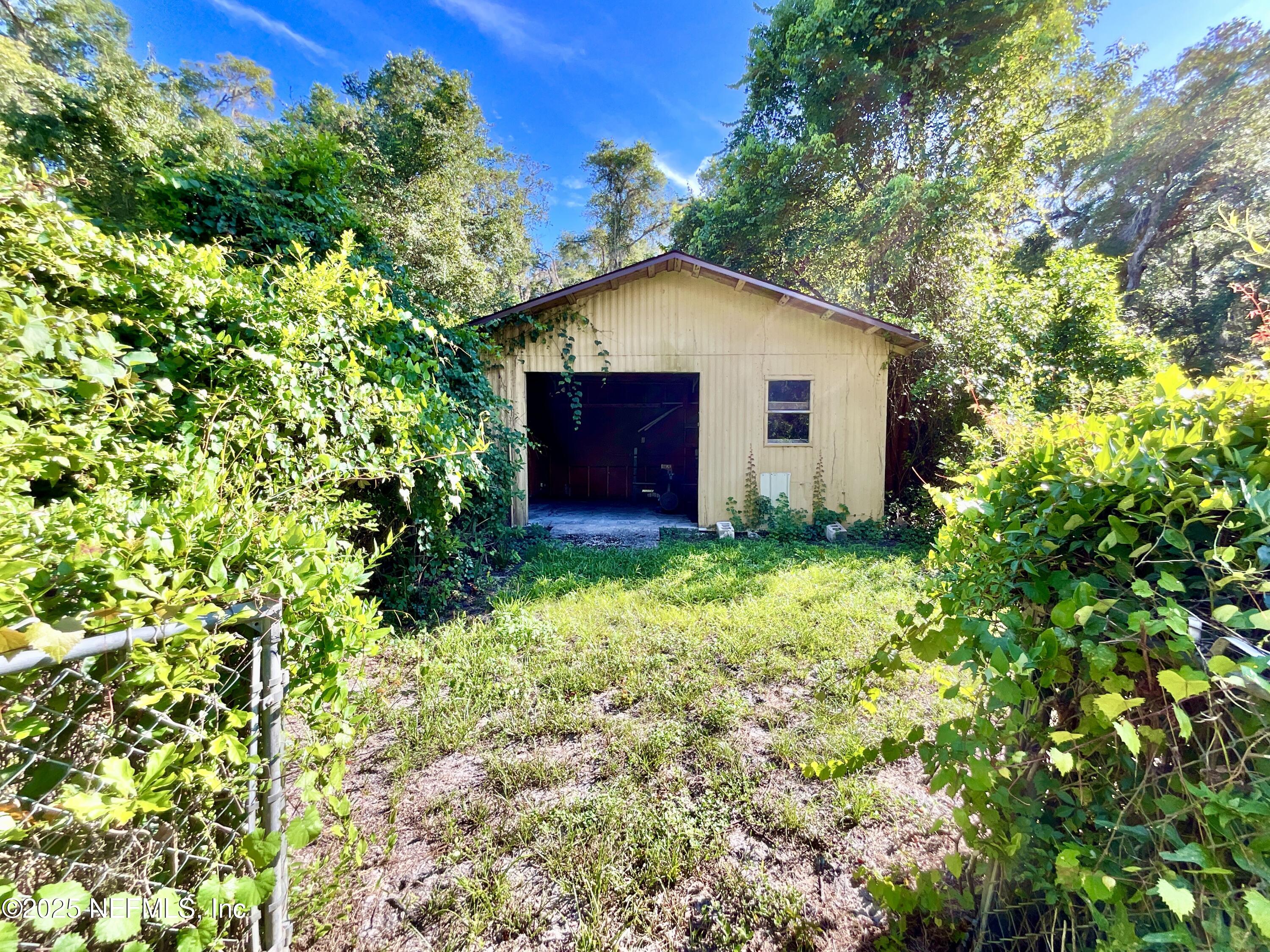 145 Depot Road Hawthorne, FL 32640 - Photo 44 of 73 a house with trees in the background