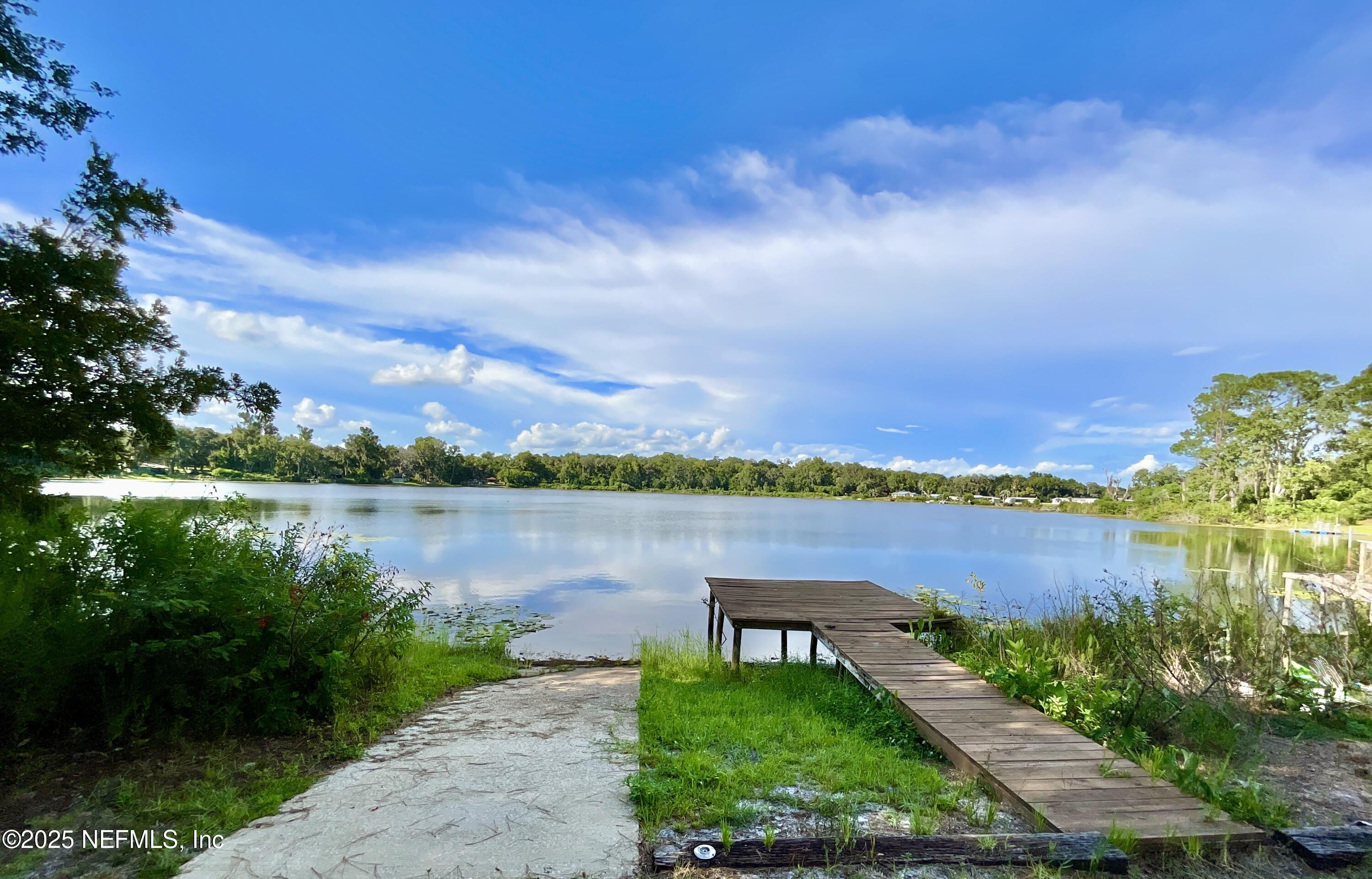 145 Depot Road Hawthorne, FL 32640 - Photo 47 of 73 a view of a lake with houses in the back