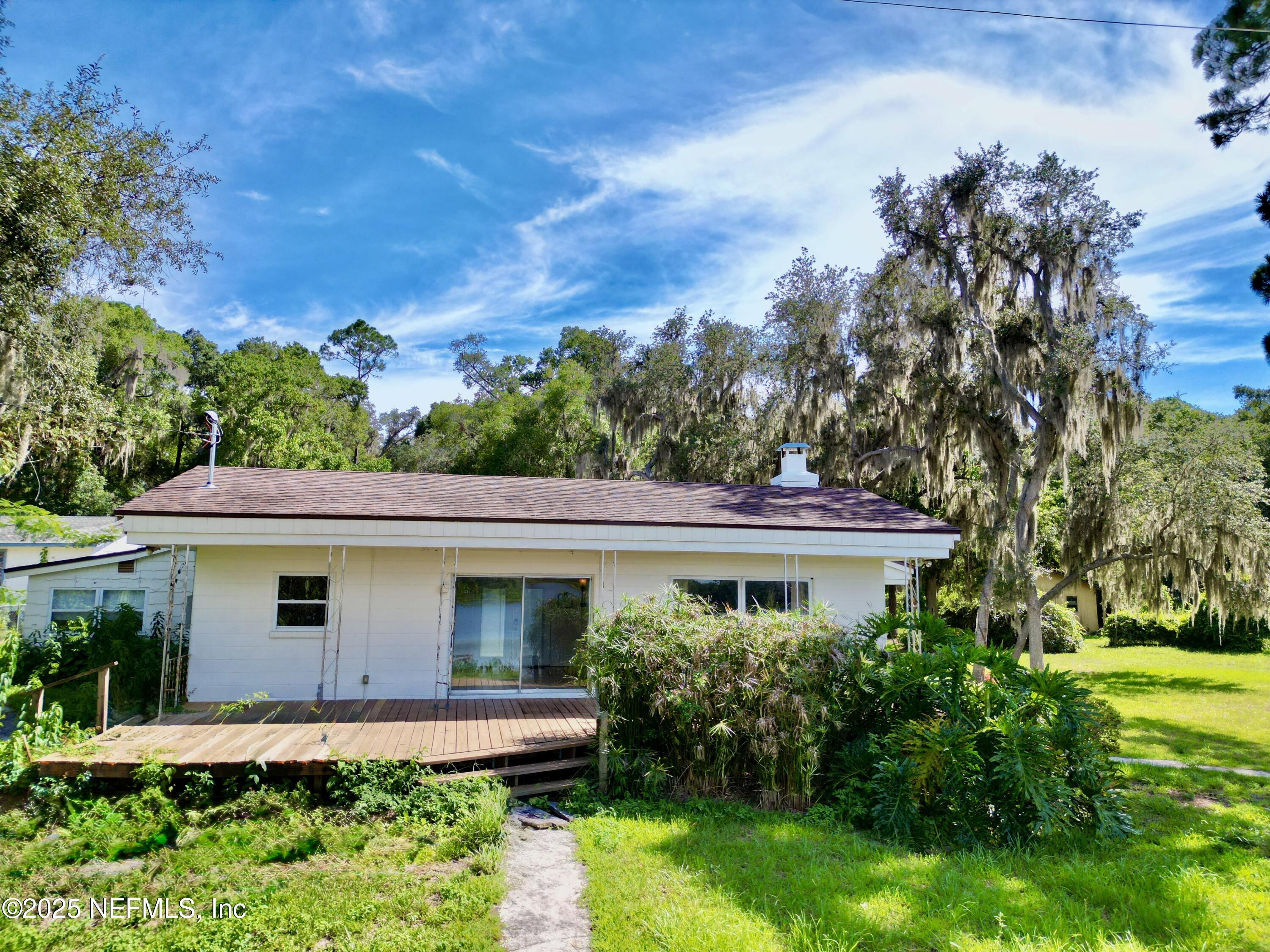 145 Depot Road Hawthorne, FL 32640 - Photo 52 of 73 a front view of a house with a yard