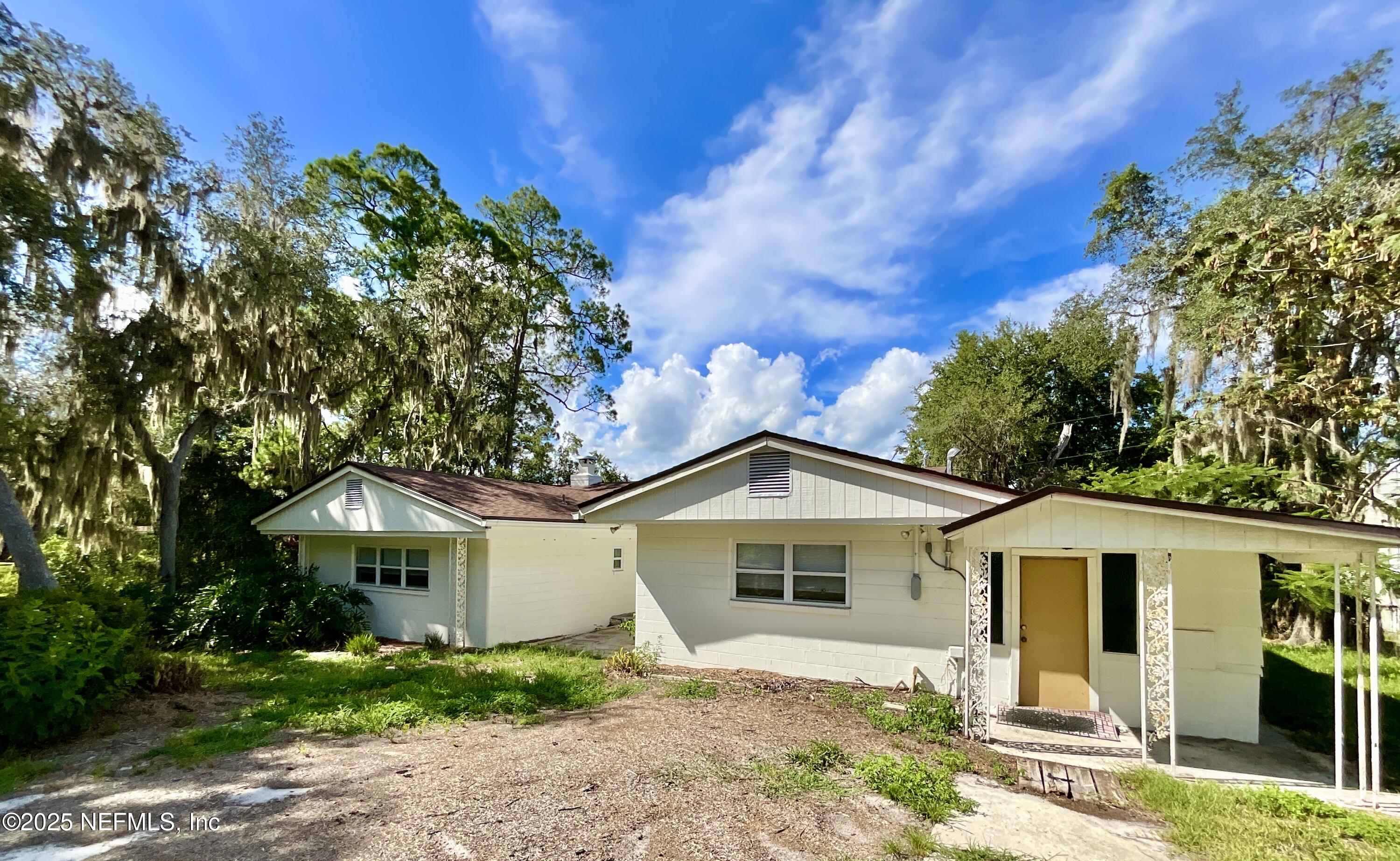 145 Depot Road Hawthorne, FL 32640 - Photo 7 of 73 a front view of a house with a yard