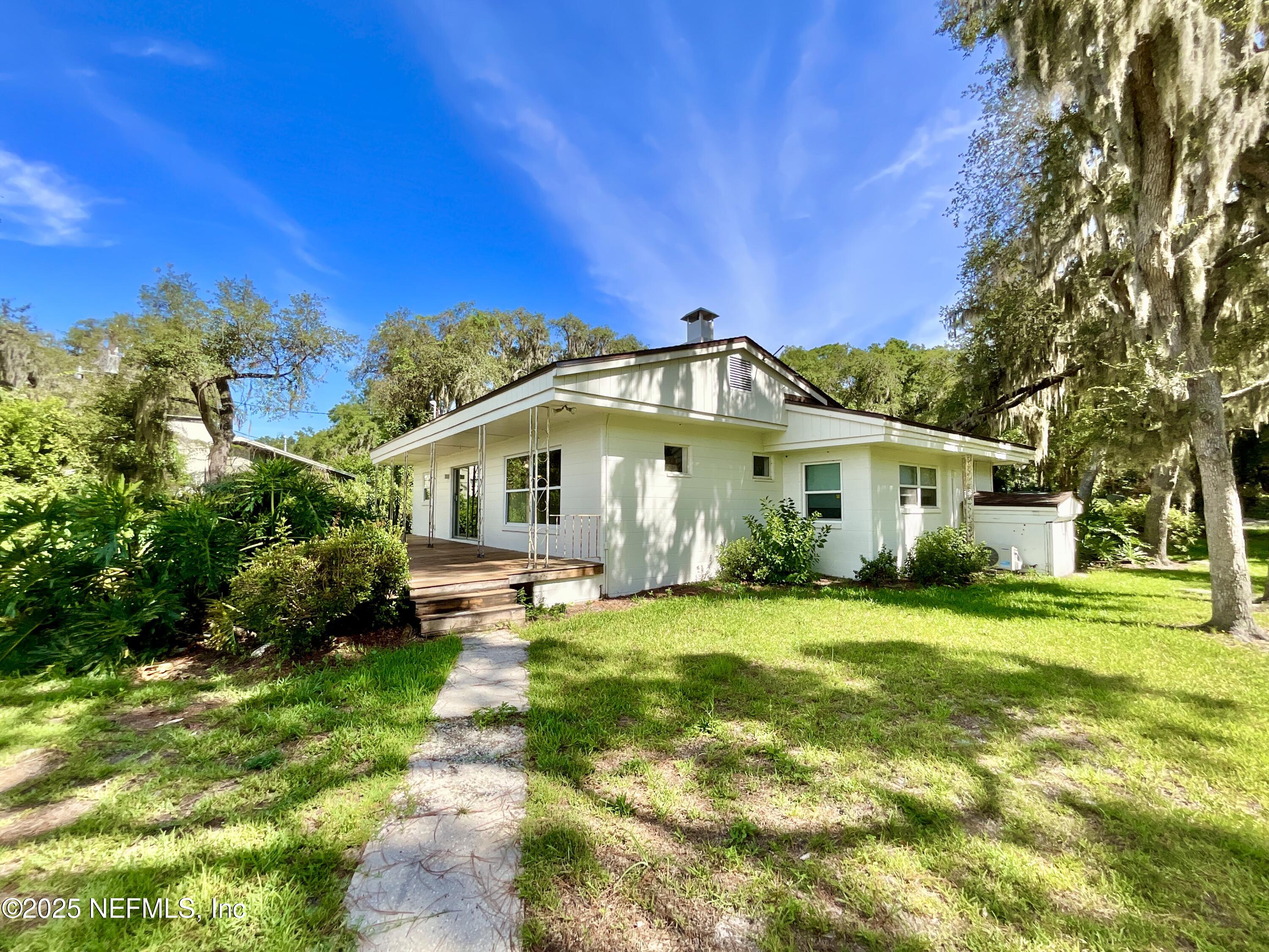 145 Depot Road Hawthorne, FL 32640 - Photo 9 of 73 a front view of a house with a yard