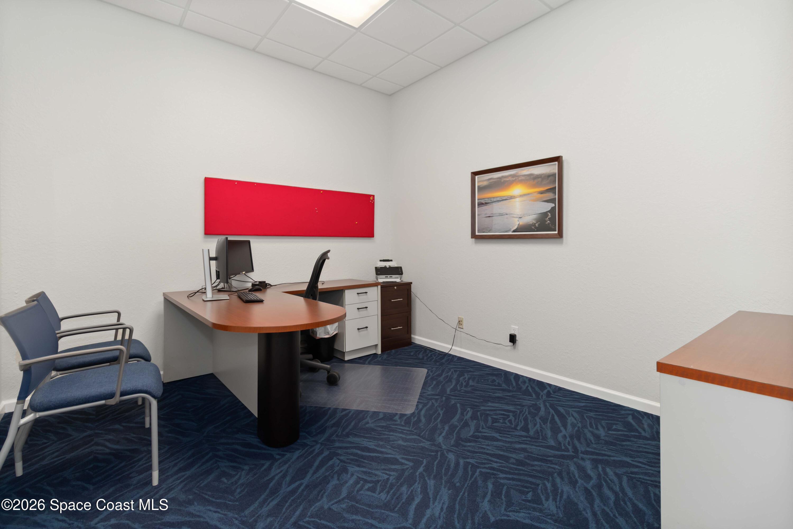 7730 North Wickham Road, Unit 101 Melbourne, FL 32940 - Photo 21 of 48 a view of a workspace with furniture