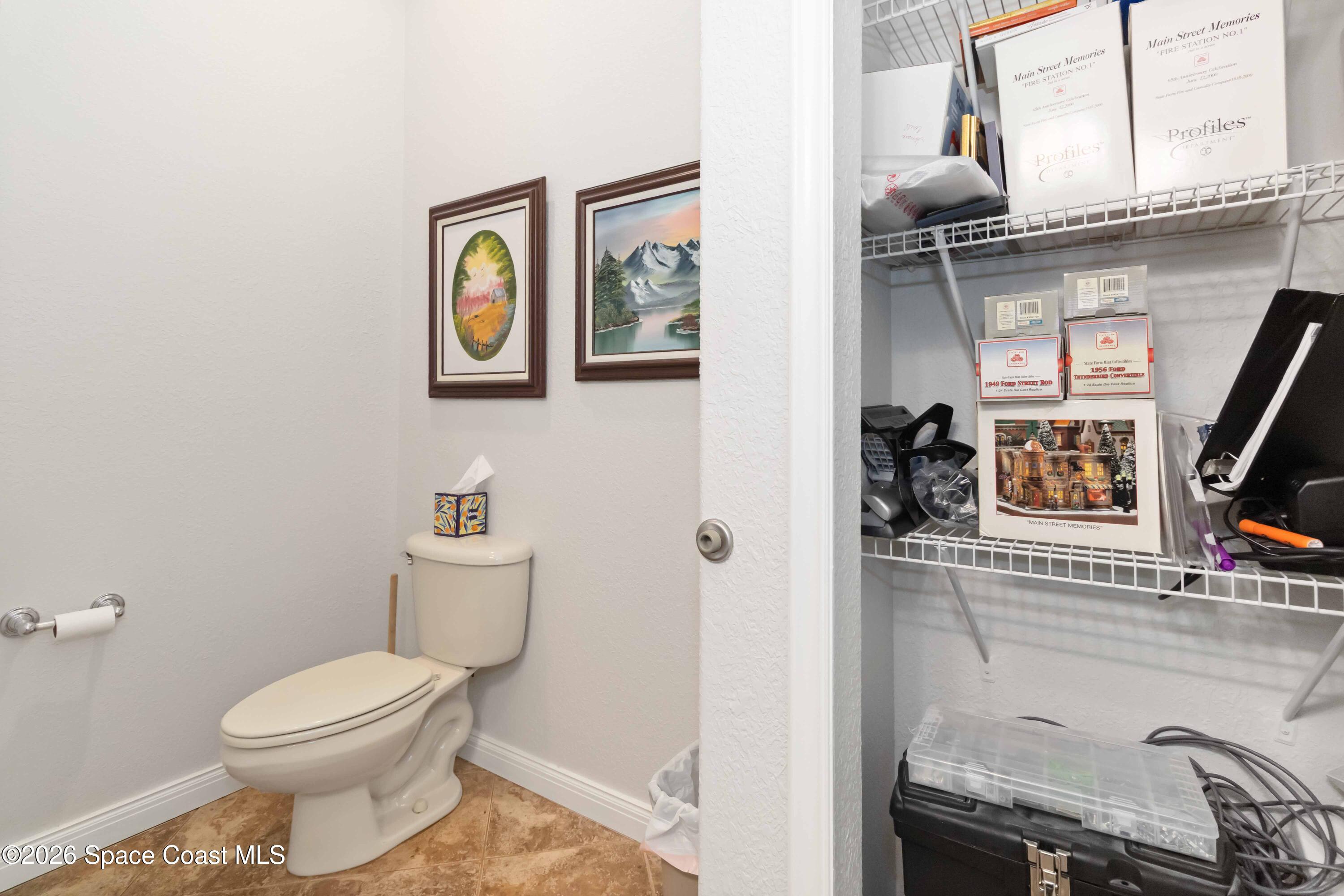 7730 North Wickham Road, Unit 101 Melbourne, FL 32940 - Photo 39 of 48 a bathroom with a toilet and a sink