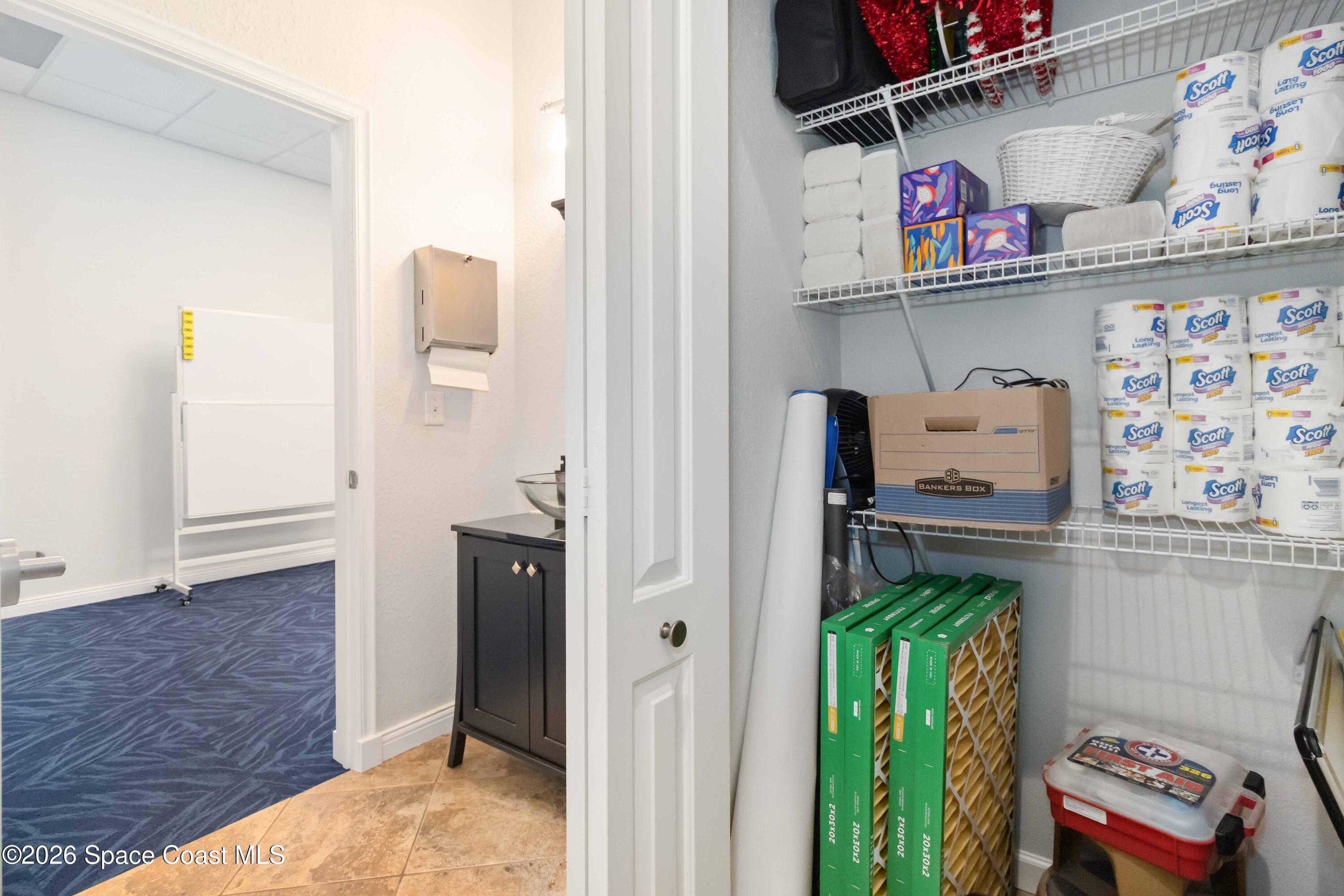 7730 North Wickham Road, Unit 101 Melbourne, FL 32940 - Photo 41 of 48 a view of storage and utility room
