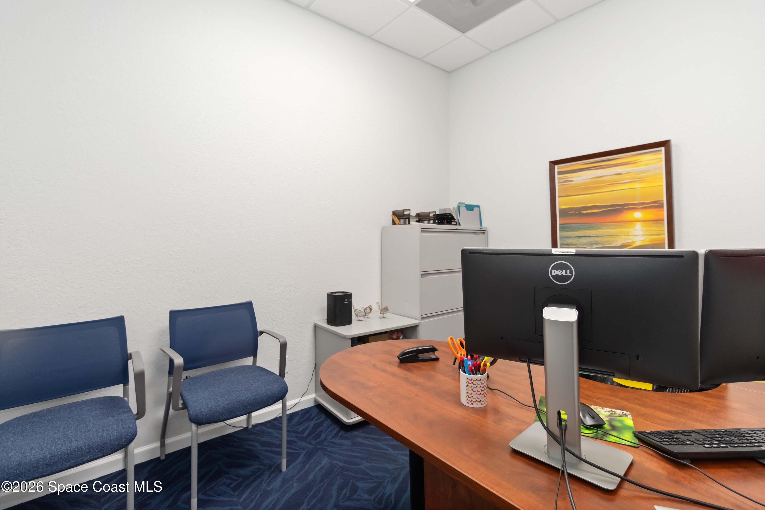 7730 North Wickham Road, Unit 101 Melbourne, FL 32940 - Photo 48 of 48 a view of a workspace with furniture